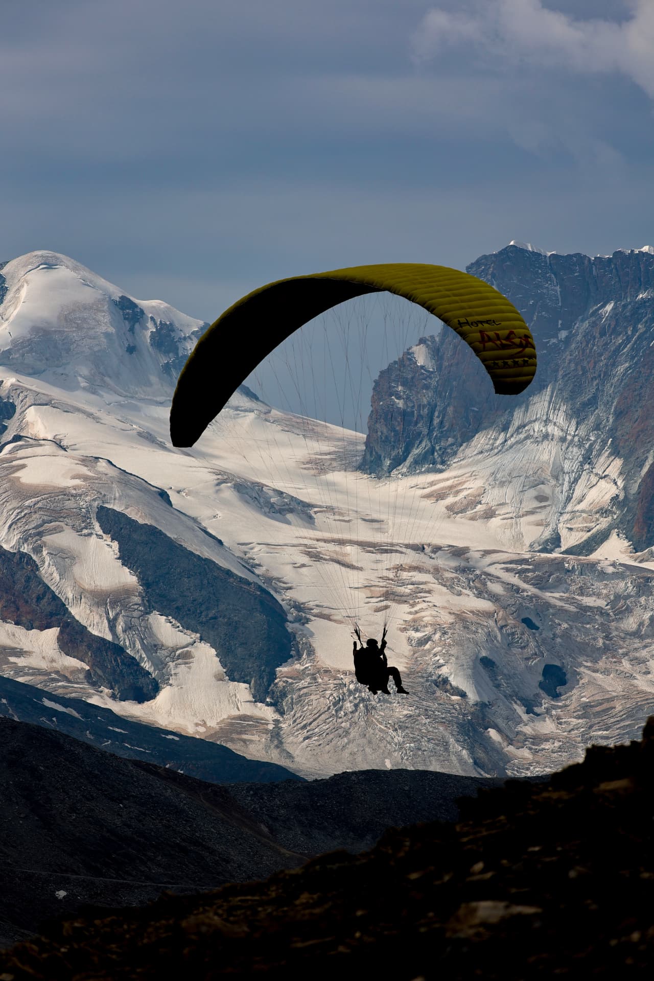 Paraglider above the glacier at the Rothorn